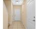 Bright foyer with tile floors, coat closet, and views of the staircase at 4528 Amberly Oaks Ct, Tampa, FL 33614