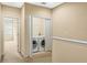 Laundry area with washer and dryer neatly tucked behind folding doors at 4528 Amberly Oaks Ct, Tampa, FL 33614