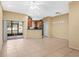Spacious living room with tile floors, sliding glass doors, and open to the kitchen at 4528 Amberly Oaks Ct, Tampa, FL 33614