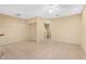 Bright living room with neutral colors, tile flooring, and an open floor plan at 4528 Amberly Oaks Ct, Tampa, FL 33614