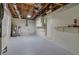 Spacious basement with unfinished ceilings, updated mechanics, and painted concrete walls at 4624 83Rd Terrace N, Pinellas Park, FL 33781