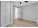 Bright bedroom with light wood floors, ceiling fan, and white trim at 4624 83Rd Terrace N, Pinellas Park, FL 33781