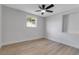 Neutral bedroom features ceiling fan and window with outside view at 4624 83Rd Terrace N, Pinellas Park, FL 33781