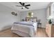 Cozy bedroom with soft bedding, neutral decor, and a ceiling fan for comfortable living at 4624 83Rd Terrace N, Pinellas Park, FL 33781