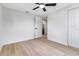 Bright bedroom with light wood floors, ceiling fan, and white trim at 4624 83Rd Terrace N, Pinellas Park, FL 33781