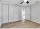 Spacious bedroom with ample closet space, featuring wood floors and an inviting atmosphere at 4624 83Rd Terrace N, Pinellas Park, FL 33781