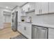 Modern kitchen features stainless steel appliances, white cabinets, and sleek countertops at 4624 83Rd Terrace N, Pinellas Park, FL 33781