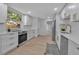 Modern kitchen features stainless steel appliances, white cabinets, and sleek countertops at 4624 83Rd Terrace N, Pinellas Park, FL 33781
