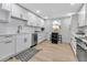 Bright, modern kitchen featuring white cabinets, stainless steel appliances, and gold hardware at 4624 83Rd Terrace N, Pinellas Park, FL 33781