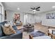 Bright living room boasts modern furnishings, light wood floors, and ample natural light at 4624 83Rd Terrace N, Pinellas Park, FL 33781