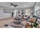 Cozy living room features stylish decor, comfortable seating, and a modern ceiling fan at 4624 83Rd Terrace N, Pinellas Park, FL 33781