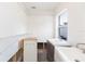 Bathroom featuring dual vanities, window, and open walls at 4714 W Lawn Ave, Tampa, FL 33611