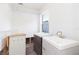 Bathroom featuring dual vanities, window, and open walls at 4714 W Lawn Ave, Tampa, FL 33611