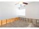 Spacious room with a ceiling fan and a large window providing natural light at 4714 W Lawn Ave, Tampa, FL 33611