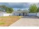 Charming single-story home with a well-maintained yard and a cozy front porch at 4714 W Lawn Ave, Tampa, FL 33611