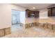 Bright kitchen awaiting remodel with an entryway to a secondary room at 4714 W Lawn Ave, Tampa, FL 33611