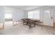 Living room features large windows and open doorway at 4714 W Lawn Ave, Tampa, FL 33611