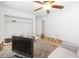 Cozy room featuring a comfortable sofa and a television for relaxation at 4714 W Lawn Ave, Tampa, FL 33611