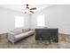 Cozy room featuring a comfortable sofa and a television for relaxation at 4714 W Lawn Ave, Tampa, FL 33611