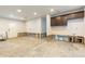 Spacious room awaiting remodel with white walls, recessed lighting, and bar at 4714 W Lawn Ave, Tampa, FL 33611