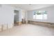 Spacious room with doorway and window, allowing ample natural light and connectivity at 4714 W Lawn Ave, Tampa, FL 33611