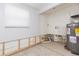 Utility room with water heater, featuring open walls at 4714 W Lawn Ave, Tampa, FL 33611