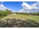 Acreage with trailer and overgrown vegetation at 4858 Troydale Rd, Tampa, FL 33615