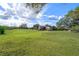 Acreage with trailer and overgrown vegetation at 4858 Troydale Rd, Tampa, FL 33615