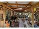 A covered patio displaying eclectic decor and rustic accents at 4858 Troydale Rd, Tampa, FL 33615