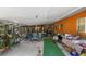 An open-air patio filled with assorted furniture and décor at 4858 Troydale Rd, Tampa, FL 33615