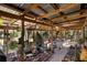 A sun-filled outdoor patio featuring open wood-beam architecture at 4858 Troydale Rd, Tampa, FL 33615
