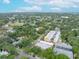 Expansive aerial view of a lush neighborhood with tree-lined streets and diverse homes, showcasing the community's beauty at 5015 S Elberon St, Tampa, FL 33611