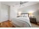 Inviting bedroom features hardwood floors, closet, and woven headboard at 5015 S Elberon St, Tampa, FL 33611