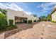 Spacious four-car garage with brick driveway, offering ample parking and storage for vehicles and equipment in a well-maintained setting at 5015 S Elberon St, Tampa, FL 33611
