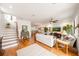 Bright and airy living space with wood floors and seamless transition to the dining and kitchen areas at 5015 S Elberon St, Tampa, FL 33611