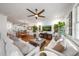 Open-concept living room with hardwood floors, contemporary furnishings, and an inviting atmosphere at 5015 S Elberon St, Tampa, FL 33611