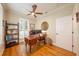 Office featuring hardwood floors, natural light from a large window, and built-ins at 5015 S Elberon St, Tampa, FL 33611