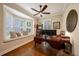 Office with hardwood floors, a ceiling fan, and a window seat with a view at 5015 S Elberon St, Tampa, FL 33611