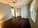 Bedroom featuring smooth wood floors, a ceiling fan, ample closet space, and natural light at 5173 Kirkland Ave, Spring Hill, FL 34606