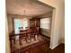Traditional dining room with wood floors, matching furniture and an elegant chandelier at 5173 Kirkland Ave, Spring Hill, FL 34606