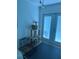 Bright sun room with french doors and a pet cage at 5173 Kirkland Ave, Spring Hill, FL 34606
