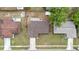 Aerial view of house with shingled roof, driveway, and sidewalk at 5213 Burr Pl, Seffner, FL 33584