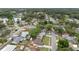 This aerial shot displays the neighborhood with lush greenery, a nearby lake, and well-maintained streets at 5213 Burr Pl, Seffner, FL 33584