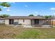 Backyard of home showcasing the patio, screened in porch and exterior brick at 5213 Burr Pl, Seffner, FL 33584