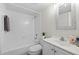 Clean bathroom featuring a shower-tub combo, white tile, and modern sink at 5213 Burr Pl, Seffner, FL 33584