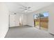 Spacious primary bedroom with an ensuite bathroom and sliding glass door to the yard at 5213 Burr Pl, Seffner, FL 33584
