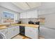 Well-lit kitchen with bright white cabinets, wood countertops, and stainless steel appliances at 5213 Burr Pl, Seffner, FL 33584