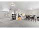 Open-concept living space flowing into a kitchen with modern appliances and light wood countertops at 5213 Burr Pl, Seffner, FL 33584