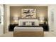 Serene bedroom with a comfortable bed, neutral tones, and stylish bedside tables at 5646 Red Kite Dr, Wimauma, FL 33598
