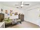 Bedroom with dresser, closet, ceiling fan, and bed with stuffed animals at 5702 Ainsworth W Ct, Tampa, FL 33647